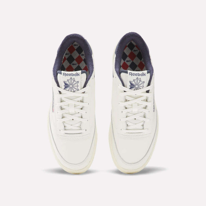The Reebok Men's Club C Golf Shoes are white, made from water-resistant leather, and feature a spikeless outsole for all-day comfort on and off the course.