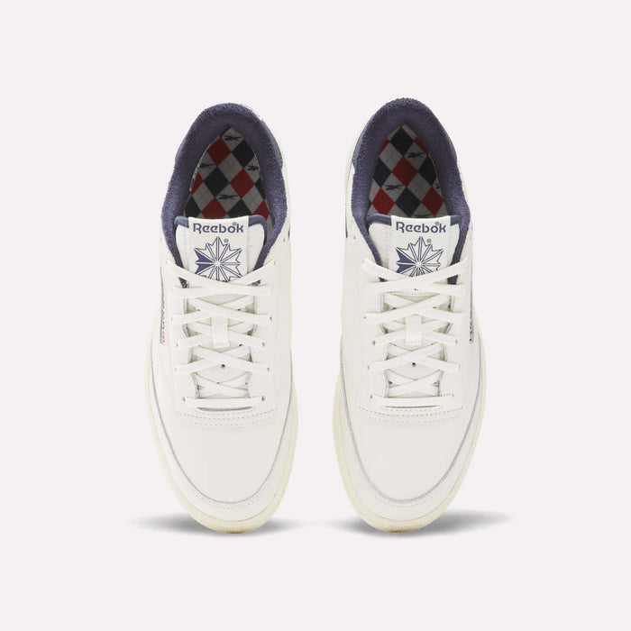 The Reebok Men's Club C Golf Shoes are white, made from water-resistant leather, and feature a spikeless outsole for all-day comfort on and off the course.