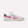 The Reebok Men's Club C Revenge Shoes, in white with red and black accents, feature premium leather and display the Reebok logo plus Union Jack on the side, shown from the left against a plain white background.