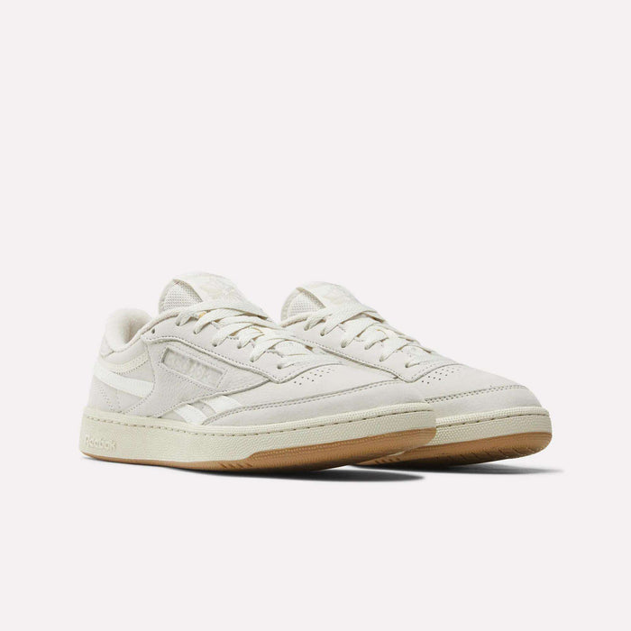 Men's Club C Revenge Shoes by Reebok in off-white, featuring light beige soles and a nubuck leather finish, displayed at a three-quarter angle on a plain white background.