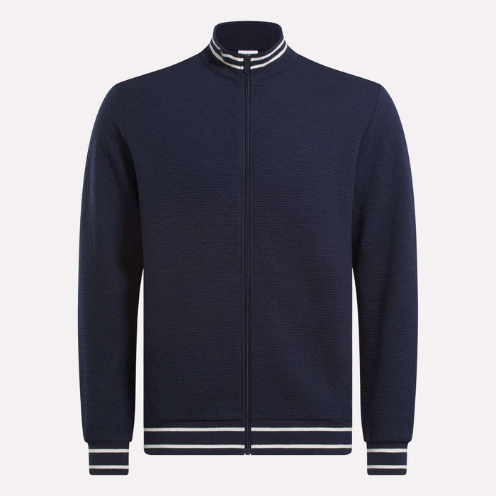The Reebok Men's Club Sport Textured Jacket is a navy zip-up with thermal knit fabric and white/navy striped ribbed collar, cuffs, and hem, shown on a plain white background.