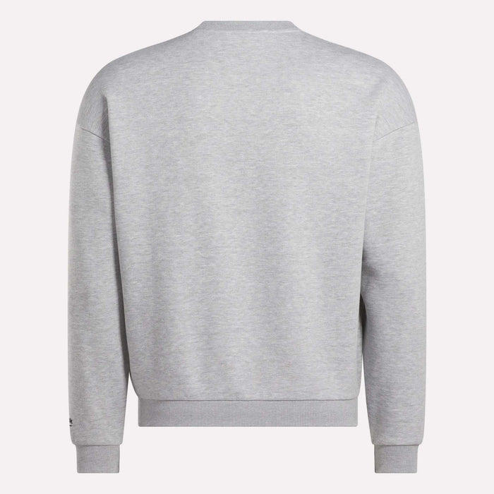 The Reebok Men's Cottle Sweatshirt is shown from the back in plain light gray, featuring a simple crewneck design with long sleeves and ribbed cuffs, hem, and collar.