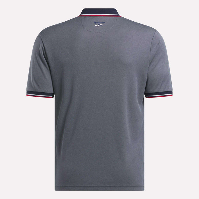 The Reebok Men's Country Club Oxford Pique Polo Shirt is shown from the back in gray with short sleeves, a dark collar and cuffs accented by white and pink trim, and the Reebok logo printed below the collar.
