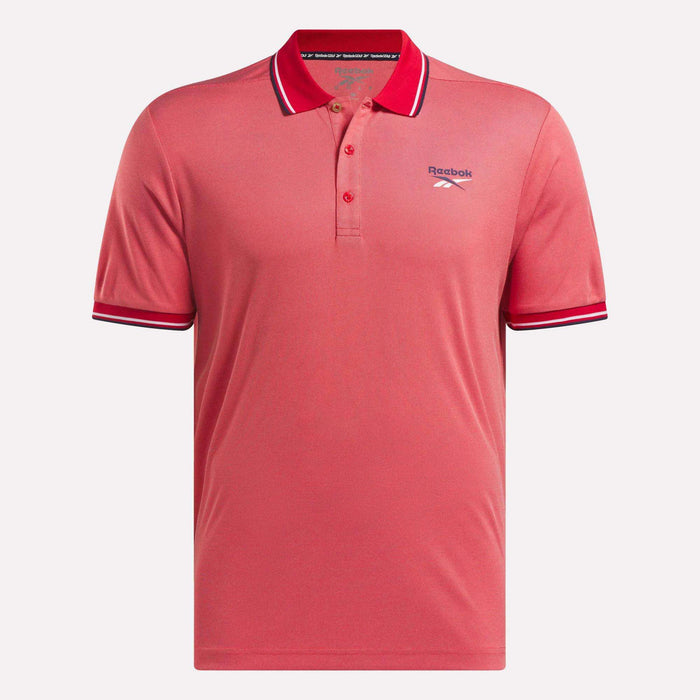 The Men's Country Club Oxford Pique Polo Shirt by Reebok is coral pink with a collar, three buttons, white and navy striped collar and sleeve cuffs, and an embroidered Reebok logo on the left chest.