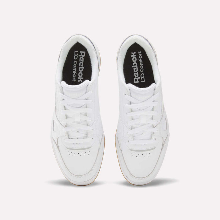 Top view of the men’s Reebok Court LXS Shoes in white, crafted from full grain leather with white laces and perforated toe detailing, displayed side by side on a light background—an ideal option for men’s court footwear.