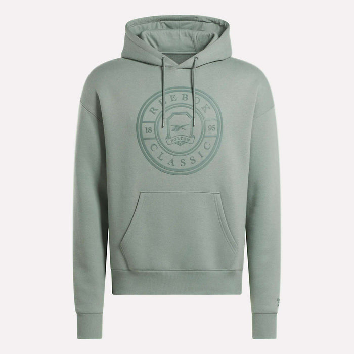 The Men's Crest Hoodie by Reebok is a light green soft fleece hoodie with a relaxed fit, front pocket, drawstring hood, and an embossed circular chest logo reading "Reebok Classic 1895 Bolton." Finished with long sleeves.