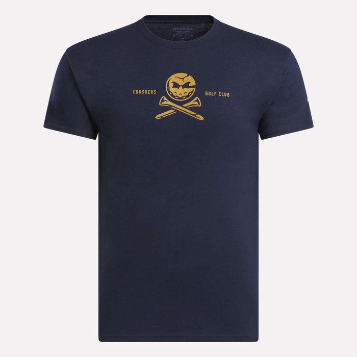 The Men's Crushers Tee by Reebok features a yellow pumpkin skull over crossed golf clubs with "Crushers Golf Club" text, offering a bold navy blue style inspired by Bryson DeChambeau.