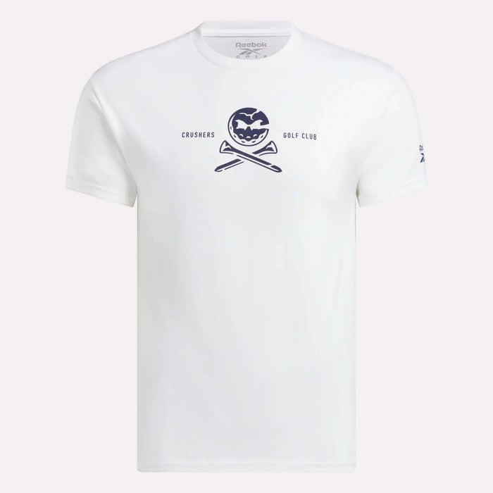The Men's Crushers Tee by Reebok is a white shirt featuring a navy pumpkin graphic above crossed golf clubs and the text "CRUSHERS GOLF CLUB," inspired by Bryson DeChambeau's passion for the Crushers.