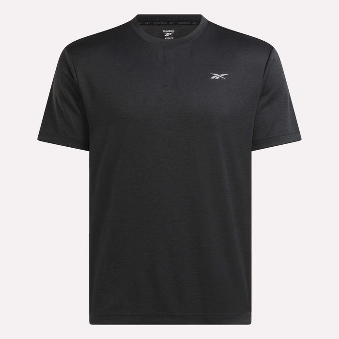 The Reebok Men’s Director Short Sleeve Top is a plain black training t-shirt featuring short sleeves and a subtle Reebok logo on the left chest, shown against a light background. Ideal as a men’s gym top for everyday workouts.