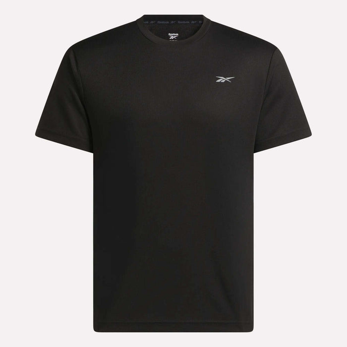 The Men's Director Short Sleeve Top by Reebok is a plain black, stretchy workout t-shirt with short sleeves and a small white Reebok logo on the left chest, shown against a white background.