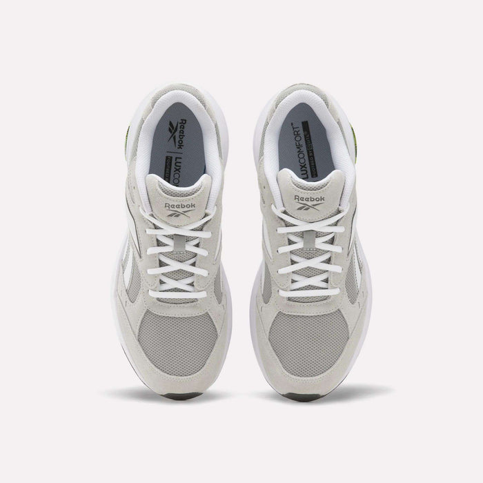 A pair of Reebok Men’s DMX Comfort+ Walk Ultra shoes in white, seen from above, showcase mesh and suede panels, white laces, the Reebok logo on the tongues, and advanced DMX Comfort+ technology—making them a top choice for men’s walking footwear.