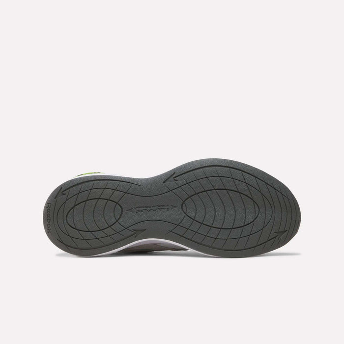 The image displays the black rubber outsole of the Reebok Men’s DMX Comfort+ Walk Ultra Shoes, featuring a wavy, textured design and DMX Comfort+ branding near the heel. The background is plain white.