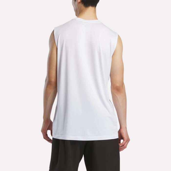 A person is seen from behind wearing a Reebok Men's Elite Sleeveless Top in white and black shorts, standing against a plain light background.