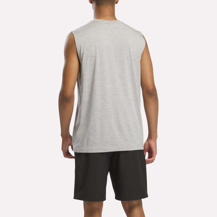 A person stands facing away, wearing the Reebok Men's Elite Sleeveless Top and black shorts against a plain white background.