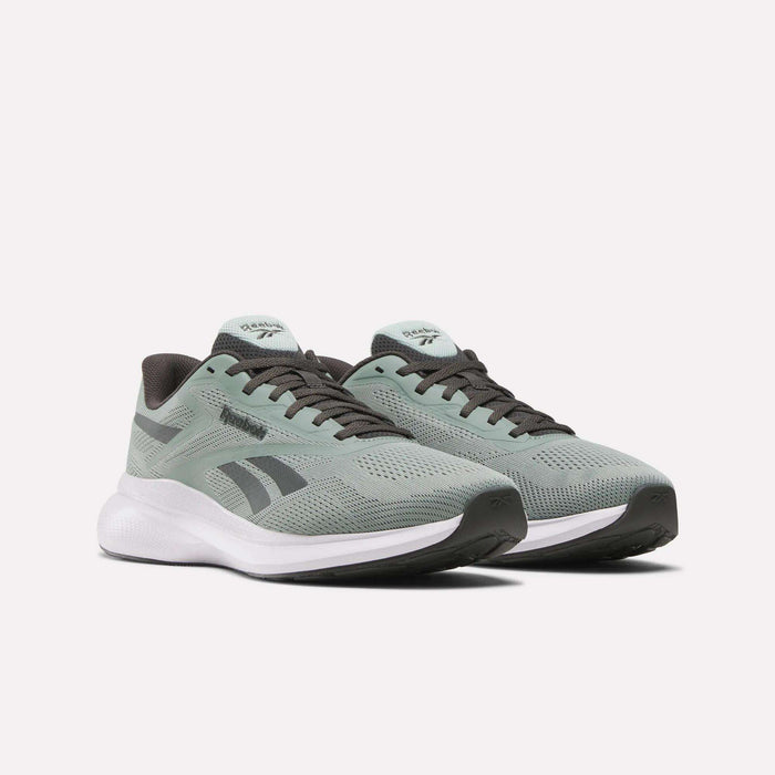 Men's Energen Run 4 Running Shoes by Reebok, in light green with black and white accents, feature a breathable mesh upper and cushioned white FuelFoam midsole, shown on a plain white background.