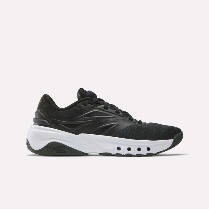 The Reebok Men's ERS Training Shoes in black feature premium cushioning and a thick white sole with circular cut-outs, displayed in a side view on a plain white background.