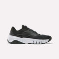 The Reebok Men's ERS Training Shoes in black feature premium cushioning and a thick white sole with circular cut-outs, displayed in a side view on a plain white background.