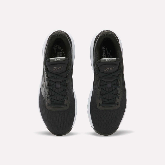 A pair of Reebok Men's ERS Training Shoes with black uppers, white soles, and gray accents on the tongue and sides are shown side by side on a plain white background, offering premium cushioning for comfort.