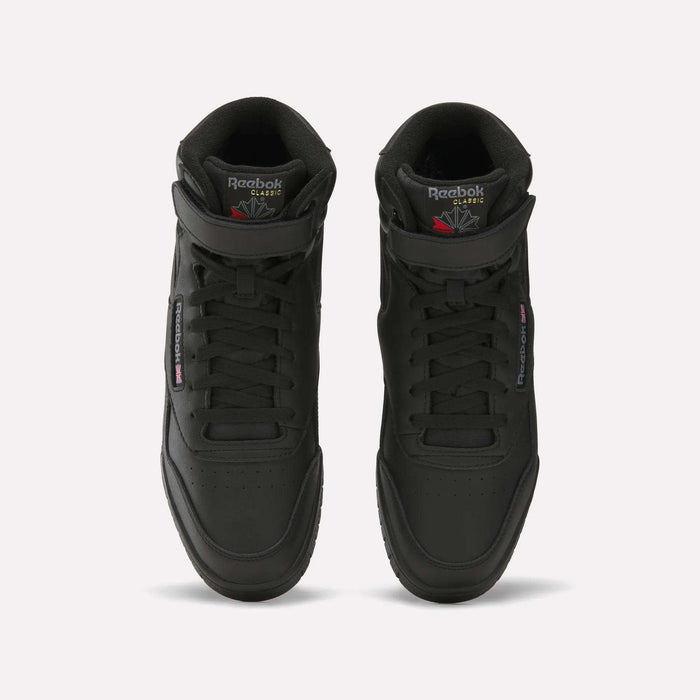 A pair of black Reebok Men's EX-O-FIT Hi shoes with an old-school design, viewed from above, featuring perforated toes, laces, and Reebok branding on the tongues and sides.