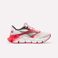 The Reebok Men's FloatZig 2 AHA Running Shoes feature a white upper with red and black accents, red laces, a gradient red and white sole, energy-returning cushioning, and a side logo, shown on a plain white background.