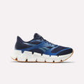 The Men's FloatZig 2 Running Shoes by Reebok feature a dark blue upper with light blue accents, a white chunky Superfloat+ cushioned sole, brown rubber outsole, and are shown in side profile on a plain white background.