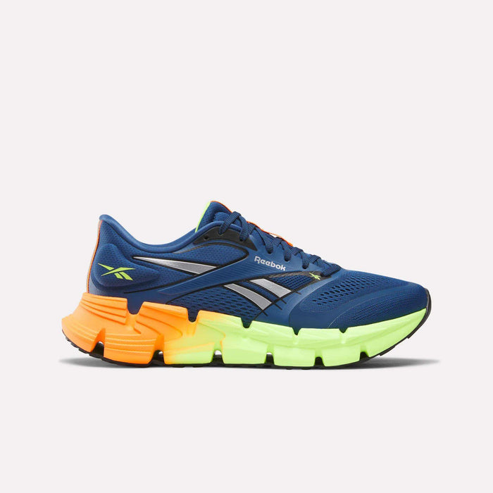 The Reebok Men's FloatZig 2 Running Shoes in blue feature gray and neon green accents, orange laces, and a chunky neon green and orange sole with Superfloat+ cushioning, shown on a plain white background.