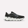 The Reebok Men's FloatZig 2 Running Shoe in black features a chunky white sole, subtle gray accents, and Superfloat+ cushioning for comfort. Shown from the side against a plain light background.
