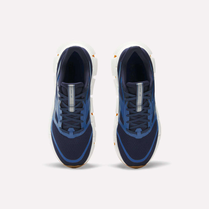 Reebok Men's FloatZig 2 Running Shoes in navy blue with white soles, mesh uppers, and light blue accents. Features Superfloat+ cushioning. Shown from a top-down view on a plain white background.