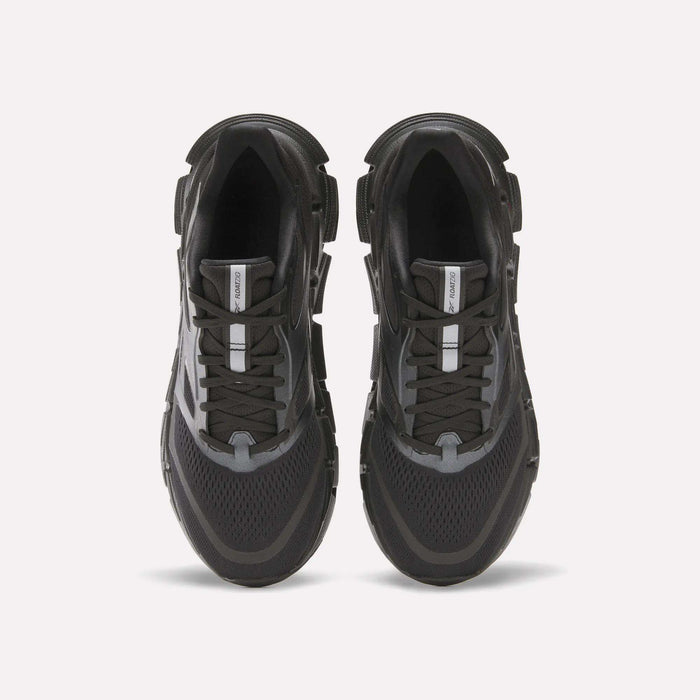 The Reebok Men's FloatZig 2 Running Shoes in black and gray are shown from above on a white background, featuring mesh panels, energy-returning cushioned soles, lace-up design, and a central logo tag on the tongue.