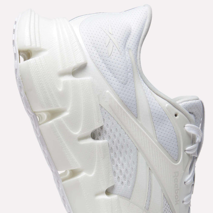 A close-up side view of the Reebok Men's FloatZig 2 Running Shoes, featuring a chunky sculpted sole, mesh upper, energy-returning cushioning, intricate panel details, and the iconic Reebok logo—ideal for running enthusiasts.