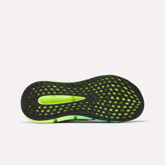 The image shows the bottom view of Reebok Men's FloatZig 2 Running Shoes, featuring a black and neon green sole with a grid-like tread pattern for traction and Superfloat+ cushioning for comfort.