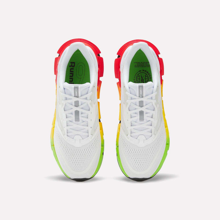 The Reebok Men's FloatZig 2 SoleMates Running Shoes are shown from above, featuring red heels, yellow lightweight foam midsoles, green toes, mesh uppers, white laces, and black outsole accents on a light background.