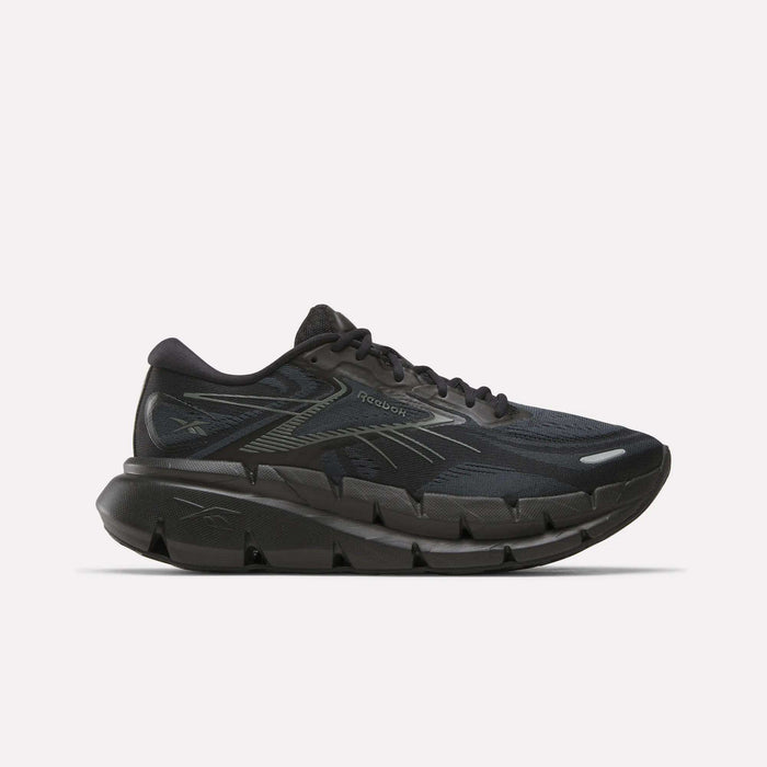 Men's FloatZig Double Running Shoes by Reebok in Black/Black/Grey, featuring a mesh upper, signature side stripes, and a thick segmented cushioned sole for maximum comfort—shown on a plain white background.