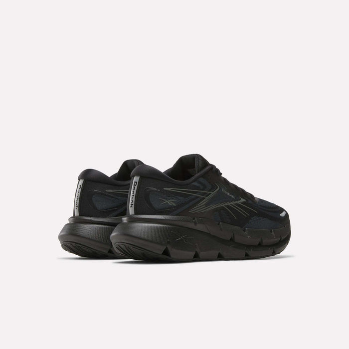 A pair of Reebok Men's FloatZig Double Running Shoes in black, cushioned with chunky soles and reflective heel details, shown from the back and side on a plain white background.