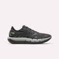 The Reebok Men's FloatZig Tread Running Shoes in black and gray feature a mesh upper, lace-up closure, thick cushioned midsole for comfort during treadmill workouts, and display the Reebok logo on the heel and side.
