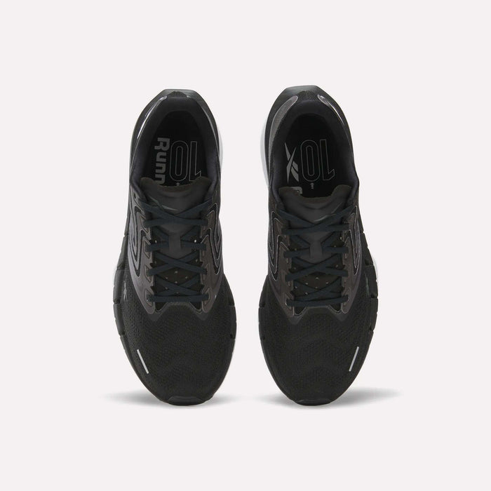 Top view of Reebok Men's FloatZig Tread Running Shoes in black with cushioned midsoles and grey accents, side by side on a white background. Insoles display “Run” and “XOL” in white—ideal for treadmill sessions.