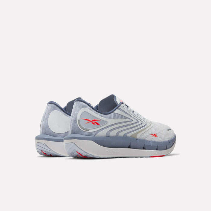 A pair of Reebok Men's FloatZig Tread Running Shoes in white and gray with red accents, showcasing a sleek, modern design—ideal for treadmill workouts—displayed side by side on a white background.