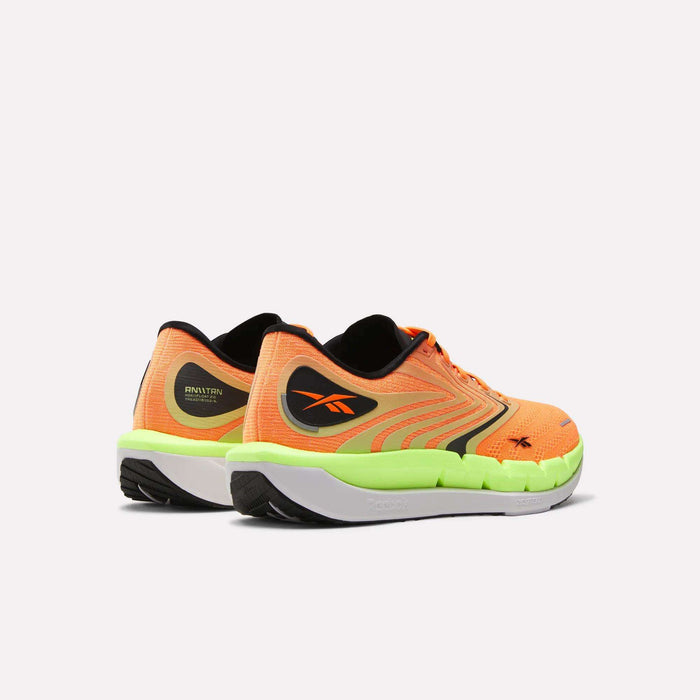 The Reebok Men's FloatZig Tread Running Shoes in orange and neon green with black and yellow accents, featuring a cushioned midsole, are shown from the back and side on a plain white background. Ideal for treadmill workouts.