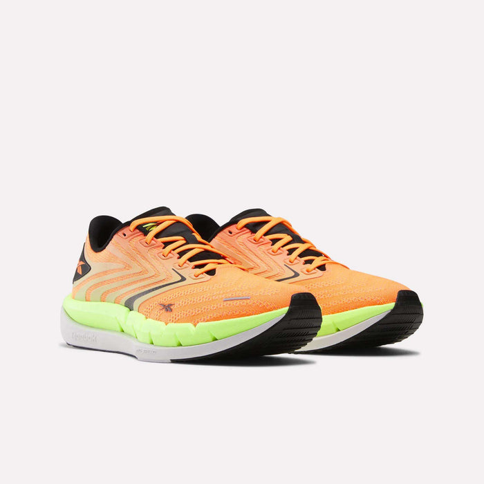 The Reebok Men's FloatZig Tread Running Shoes feature a bright orange design with black and neon green accents, cushioned midsoles, and black outsoles—perfect for treadmill workouts. Displayed on a plain white background.