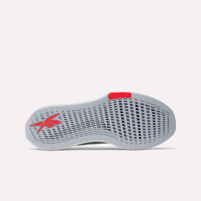 The image shows the sole of the Men's FloatZig Tread Running Shoes by Reebok in light gray, featuring a grid-like tread pattern, a red Reebok logo near the heel, and a red accent at the toe—perfect for treadmill workouts.