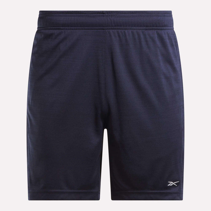 Reebok Men's Inclination Shorts in navy blue, featuring an elastic waistband and a small white logo on the lower left leg, designed for workout performance, shown against a plain light background.
