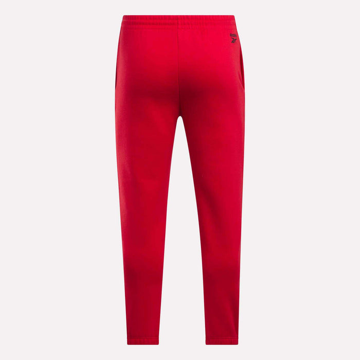 Reebok Men's Joggers in bright red fleece, featuring an elastic waistband, tapered legs, and a small black logo near the right hip, shown from the back on a plain white background.