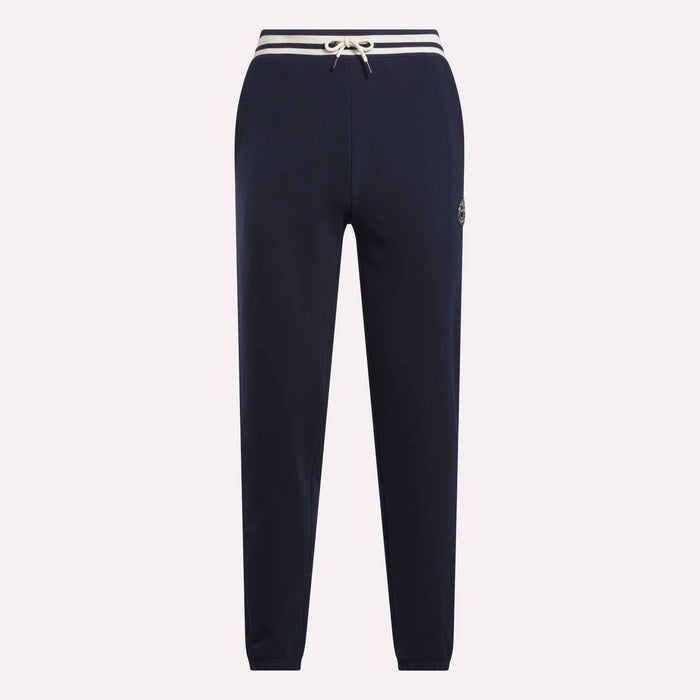 Men's Lawn Club French Terry Jogger Pants by Reebok in navy blue, featuring a white drawstring waist, white-striped waistband, and small circular logo on the left thigh, made from soft cotton-blend material. Displayed on a plain background.