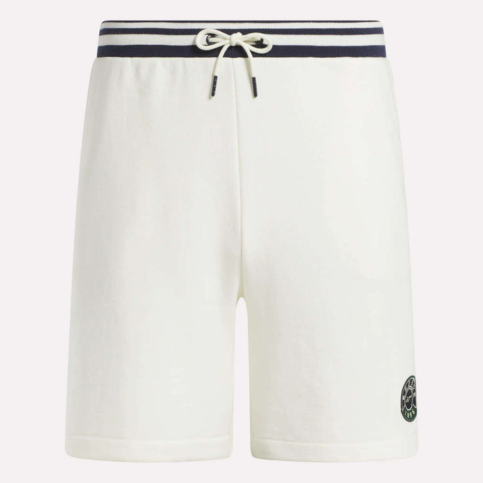 Reebok Men's Lawn Club Shorts in white cotton blend feature a navy and white striped waistband, drawstring tie, and a small black circular logo on the lower left leg, displayed against a plain background.