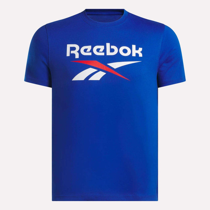 The Reebok Men's Logo Crewneck T-Shirt, in blue cotton, features a bold white and red Vector logo with text on the chest, shown against a plain white background.