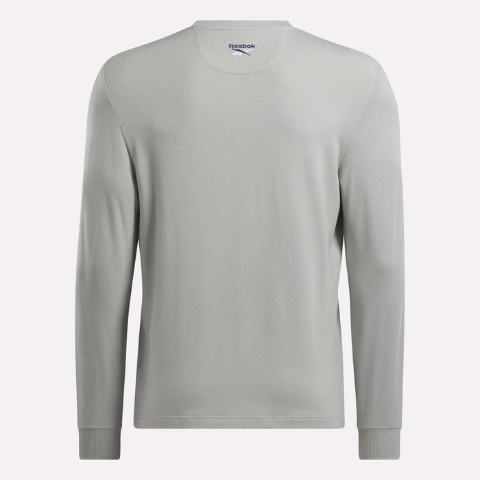 A plain light gray Men's Long Sleeve Golf Sweatshirt by Reebok is shown from the back. It features subtle stitching, a crew neckline, UPF 30+ protection, and the Reebok logo printed inside the collar.