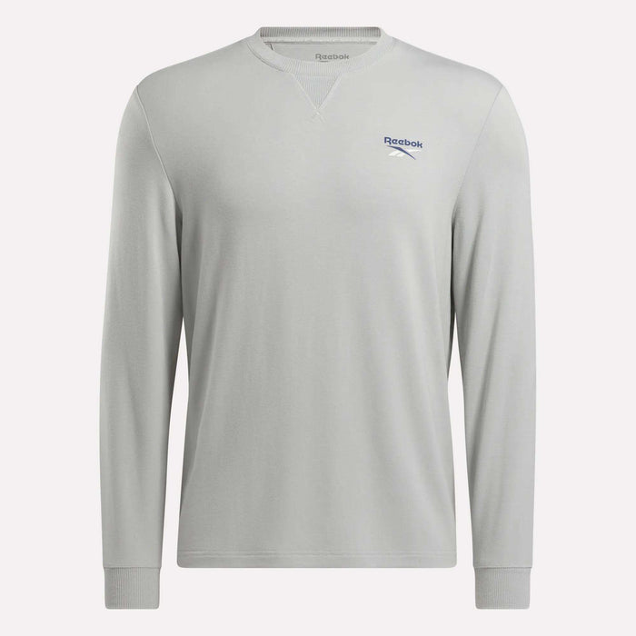Reebok Men's Long Sleeve Golf Sweatshirt in light grey with crew neck, ribbed cuffs and collar, small blue logo on left chest, plain minimal design, and UPF 30+ protection—ideal for performance golf.