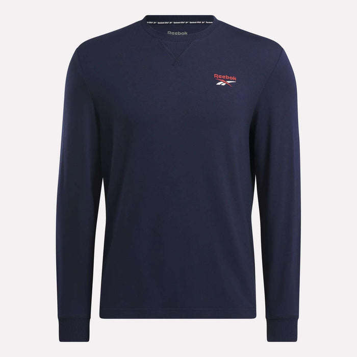 The Reebok Men's Long Sleeve Golf Sweatshirt in navy blue features a crew neck, ribbed cuffs, UPF 30+ fabric, and a small red logo with white vector on the left chest for a simple, classic look.