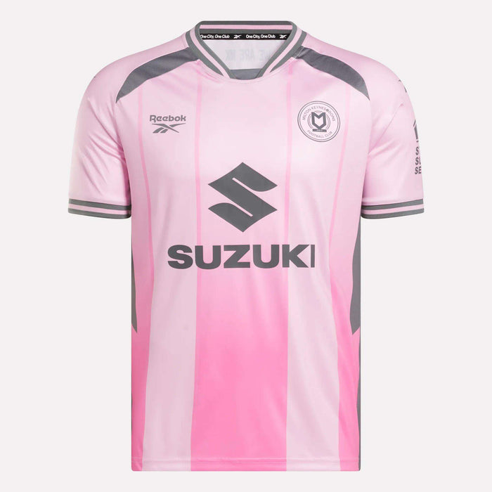 The Men's MK Dons Third Jersey by Reebok features a pink and light gray design with dark gray sleeve stripes, gray accents, Suzuki sponsor, round Milton Keynes badge on the chest, and extra text on the right sleeve.