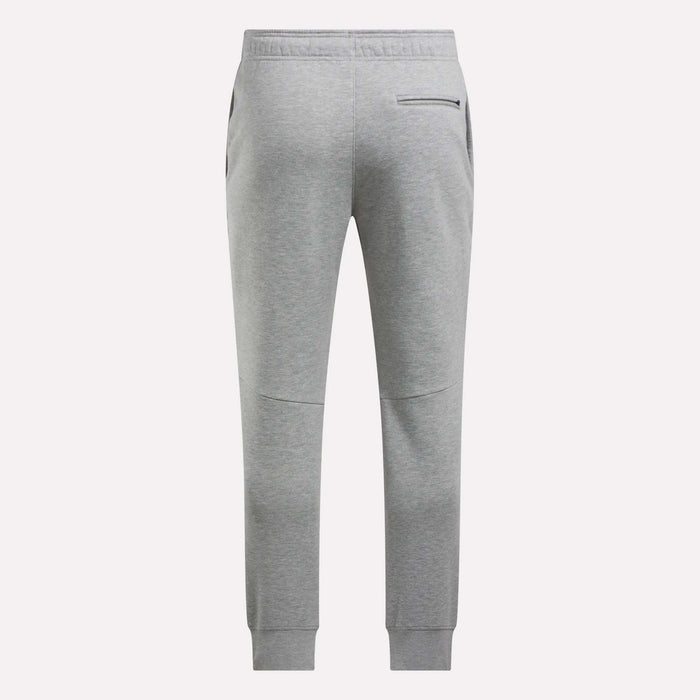Back view of Reebok Men's Motion Joggers in light gray featuring a slim fit, elastic waistband, two side pockets, a zippered back pocket, and ribbed ankle cuffs.